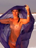 Beautiful sunset scenery by the shore of a salt lake, featuring a blue shawl