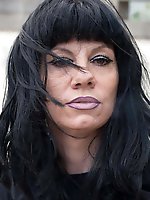 Busty older dame playing herself