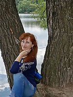 A beautiful mature woman is fondling her genital area